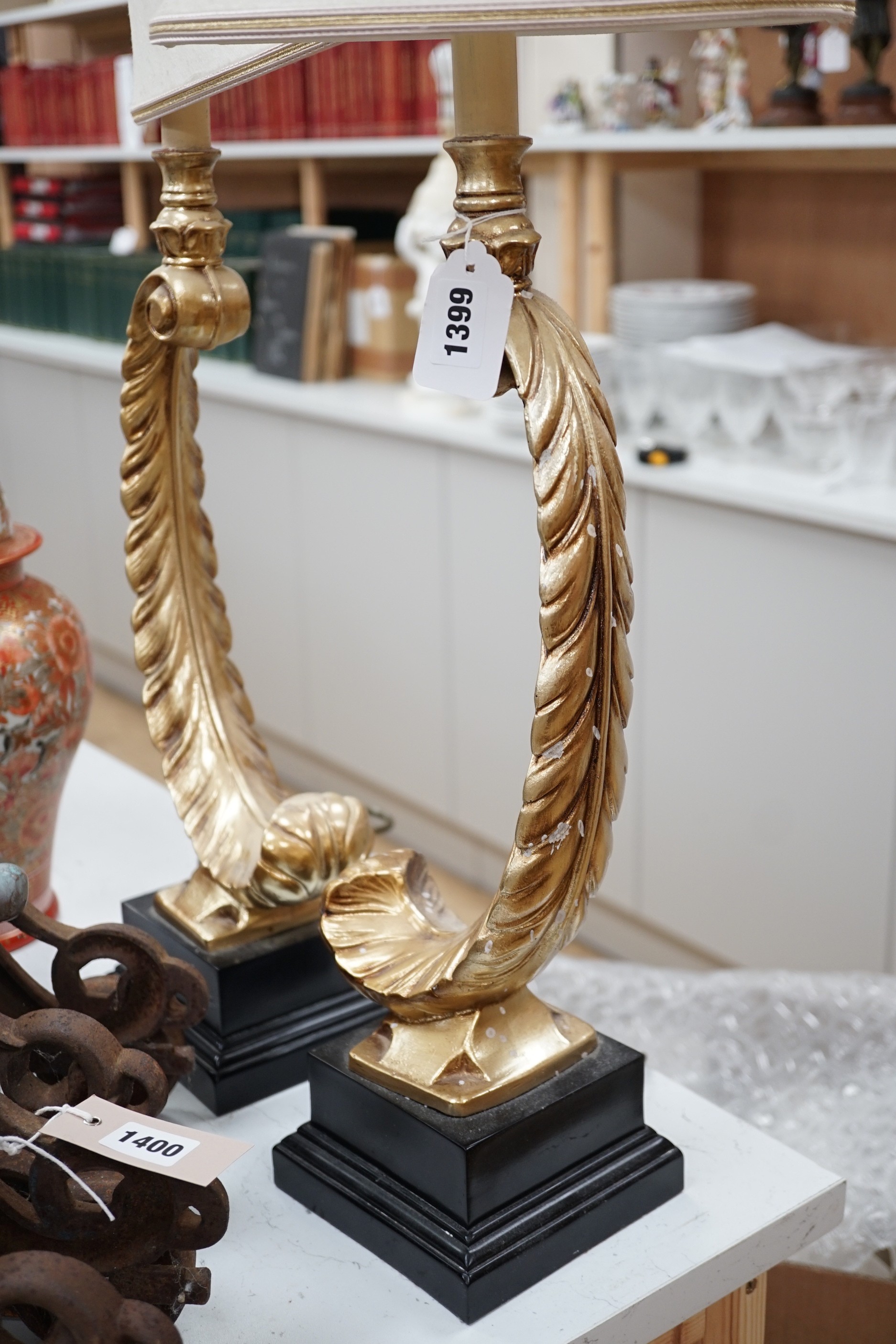 A pair of gilt resin feather table lamps. 72cm high